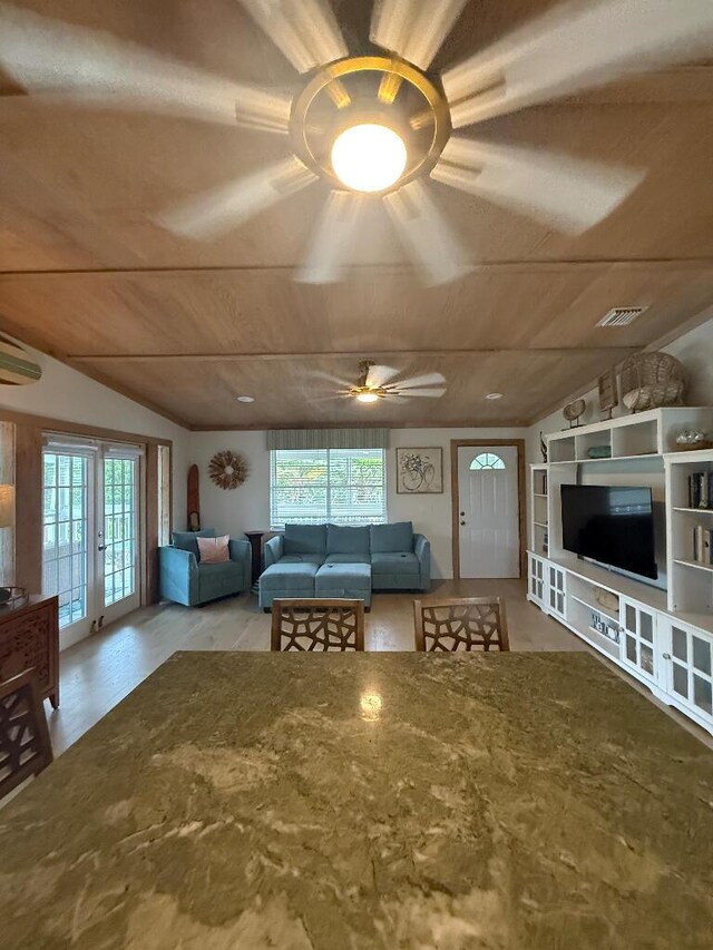 1672 Pandorea Ln, Big Pine, FL 33043 - living room featuring ceiling fan, lofted ceiling, wood ceiling, a wall unit AC, and wood finished floors
