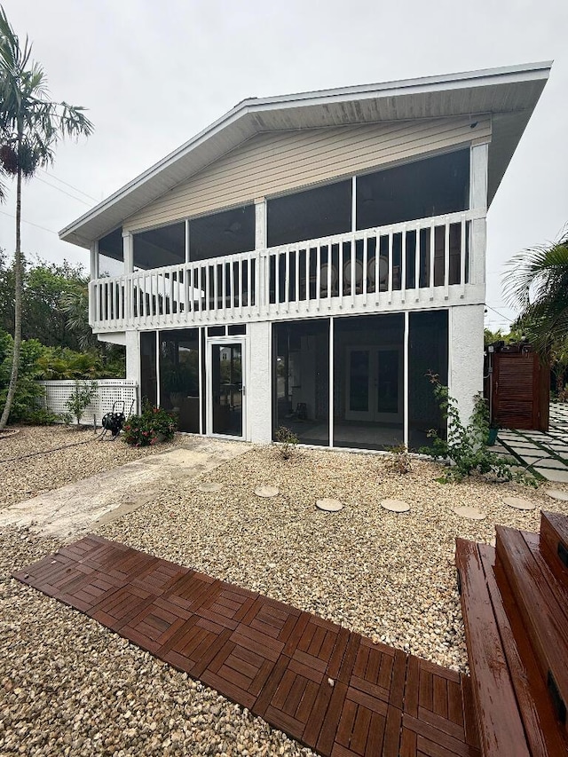 1672 Pandorea Ln, Big Pine, FL 33043 - back of house featuring french doors, a patio area, and a sunroom