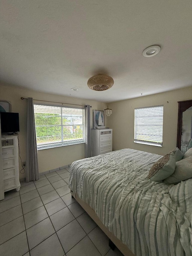 1672 Pandorea Ln, Big Pine, FL 33043 - bedroom with light tile patterned flooring and multiple windows