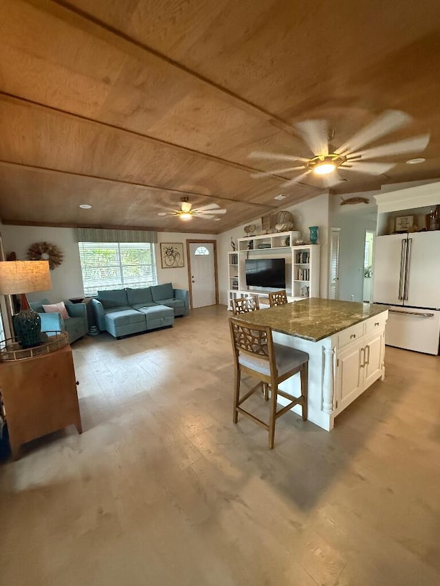 1672 Pandorea Ln, Big Pine, FL 33043 - kitchen featuring high quality fridge, a ceiling fan, wood ceiling, open floor plan, and wood finished floors