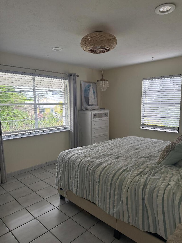 1672 Pandorea Ln, Big Pine, FL 33043 - bedroom with multiple windows, light tile patterned floors, and recessed lighting