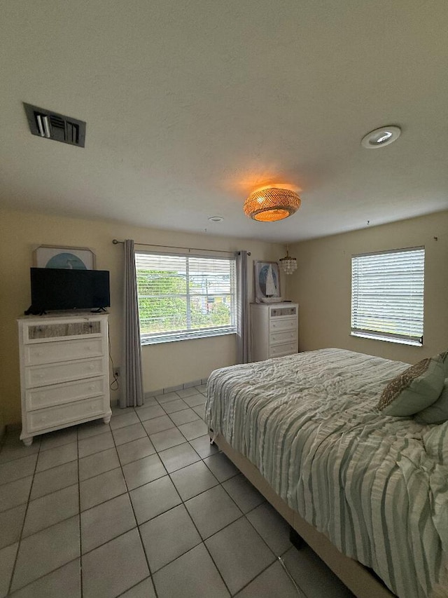 1672 Pandorea Ln, Big Pine, FL 33043 - bedroom featuring light tile patterned floors and multiple windows