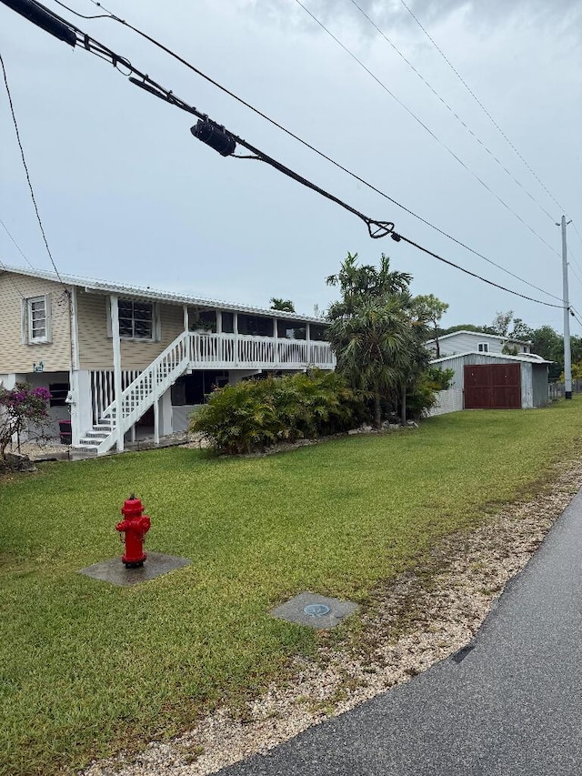 1672 Pandorea Ln, Big Pine, FL 33043 - view of grassy yard featuring stairs