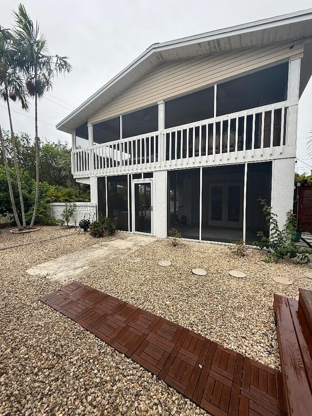1672 Pandorea Ln, Big Pine, FL 33043 - rear view of house with a patio, a sunroom, and french doors
