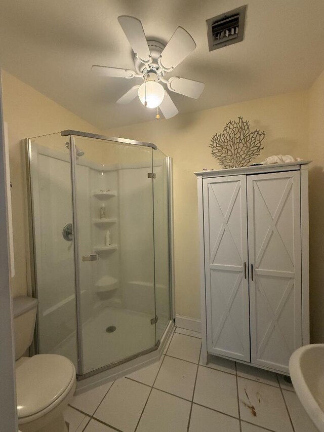 1672 Pandorea Ln, Big Pine, FL 33043 - bathroom with a stall shower, ceiling fan, and tile patterned floors