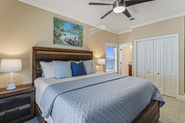 tiled bedroom with crown molding, a closet, and ceiling fan