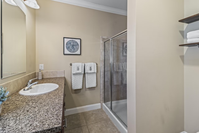 bathroom featuring vanity, crown molding, tile patterned floors, and walk in shower