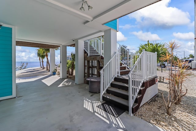 view of patio with a water view