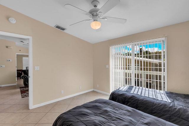 bedroom featuring ceiling fan, access to outside, and light tile patterned floors