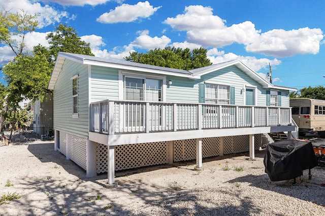 back of property featuring a deck