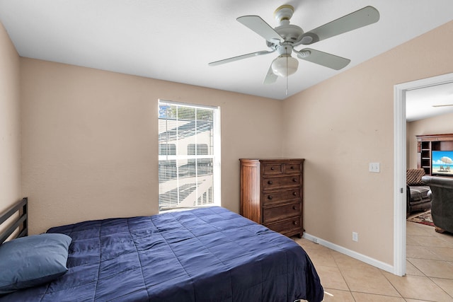 bedroom with light tile patterned floors and ceiling fan