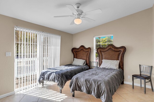 tiled bedroom featuring lofted ceiling, access to exterior, and ceiling fan