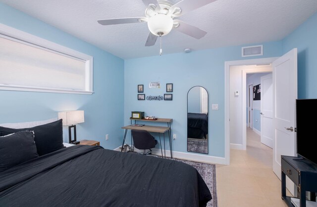 453 Lime Dr, Key Largo, FL 33037 - bedroom featuring a textured ceiling, a ceiling fan, and baseboards
