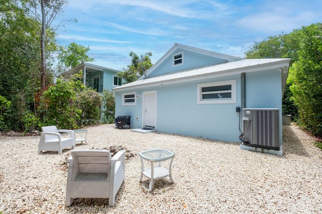453 Lime Dr, Key Largo, FL 33037 - back of property with cooling unit and stucco siding