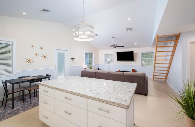 453 Lime Dr, Key Largo, FL 33037 - kitchen with light tile patterned floors, a ceiling fan, a chandelier, a kitchen island, and recessed lighting