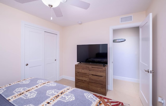 453 Lime Dr, Key Largo, FL 33037 - bedroom with a closet, baseboards, a ceiling fan, and light tile patterned floors