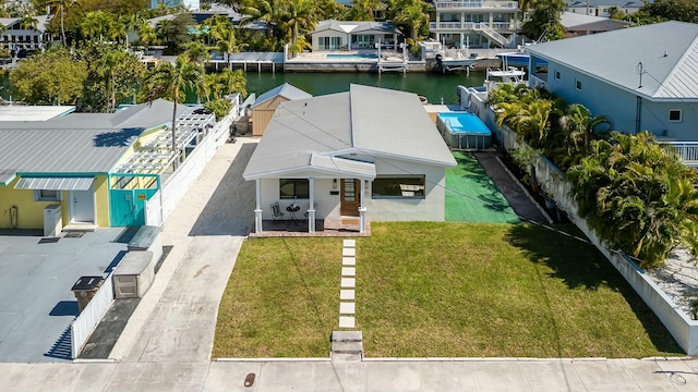 aerial view featuring a water view and a residential view