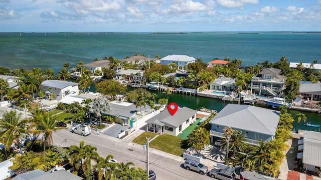 bird's eye view with a water view and a residential view