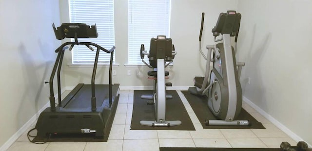 workout room featuring light tile patterned floors