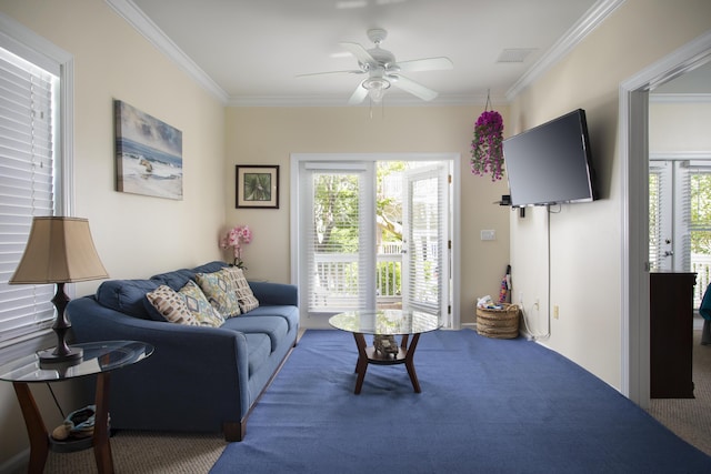 living room featuring a wealth of natural light, ornamental molding, and ceiling fan