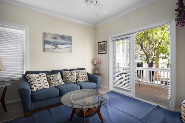 living room with ornamental molding, carpet, and a wealth of natural light