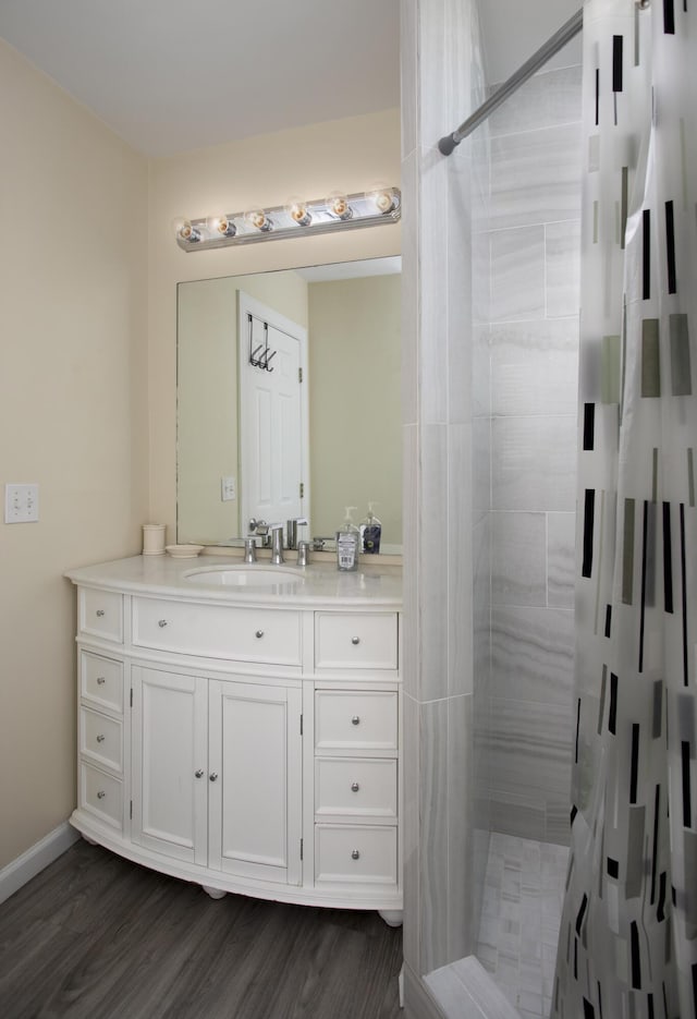 bathroom featuring a shower with curtain, vanity, and hardwood / wood-style floors