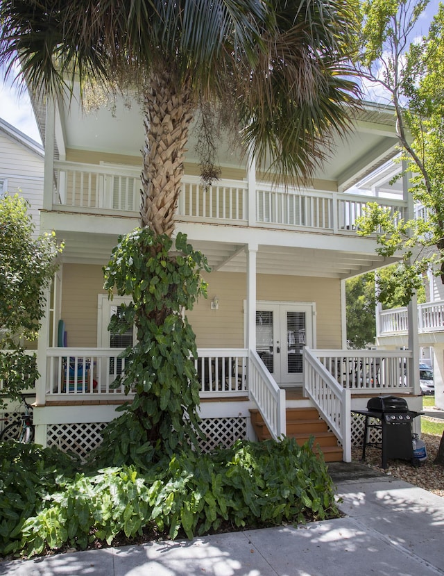 exterior space with french doors and a balcony