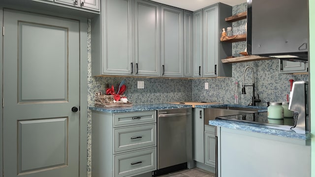 kitchen with tasteful backsplash, gray cabinets, and sink