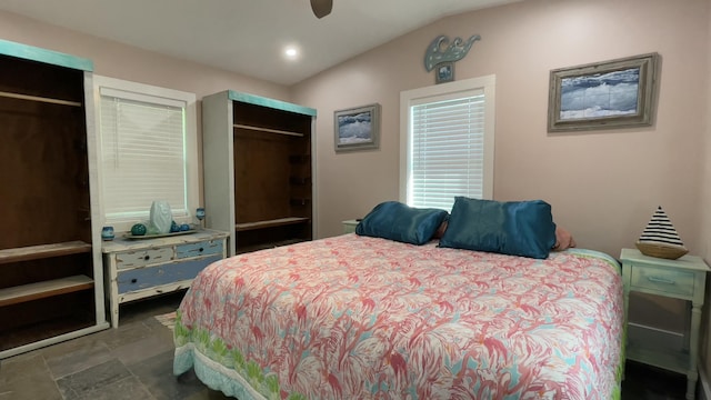 bedroom featuring vaulted ceiling and ceiling fan