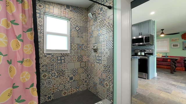 bathroom featuring a shower with curtain and ceiling fan