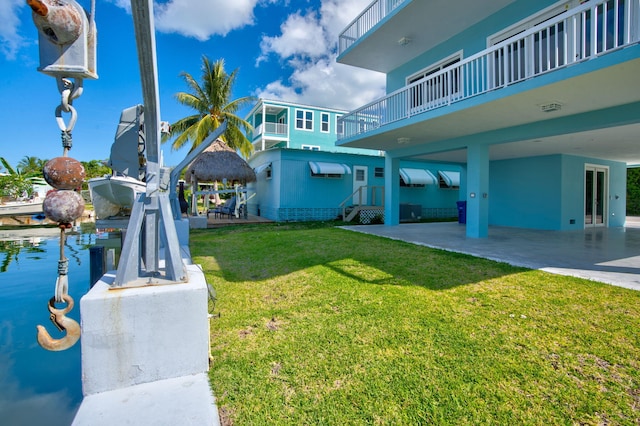 surrounding community with a patio area and a lawn