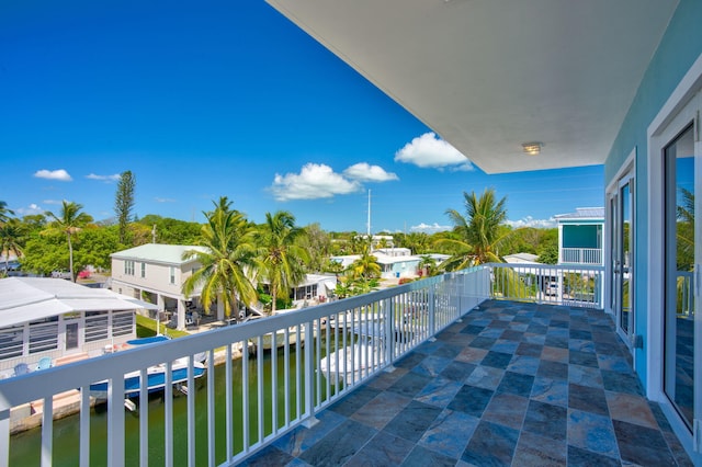 balcony featuring a water view