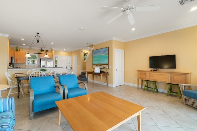 living room with crown molding, ceiling fan, and light tile patterned flooring