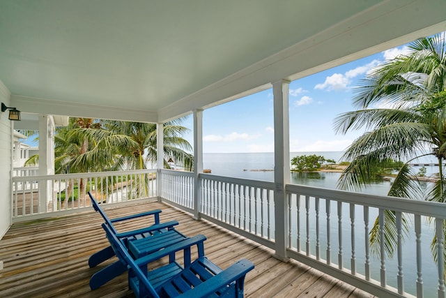 wooden deck with a water view