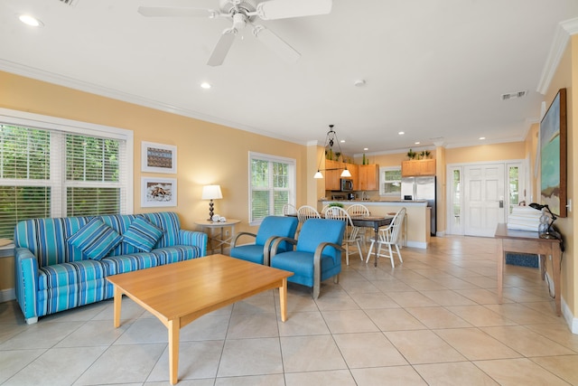 living room featuring crown molding, ceiling fan, and light tile patterned flooring