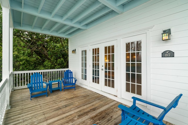 wooden deck featuring french doors