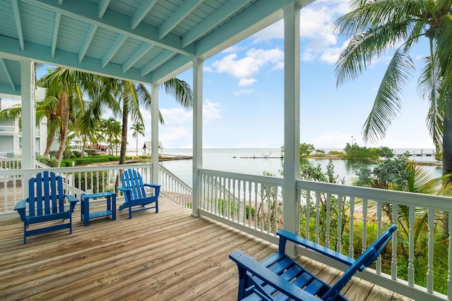 wooden deck featuring a water view