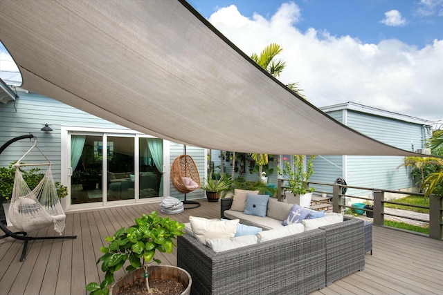 wooden terrace with outdoor lounge area