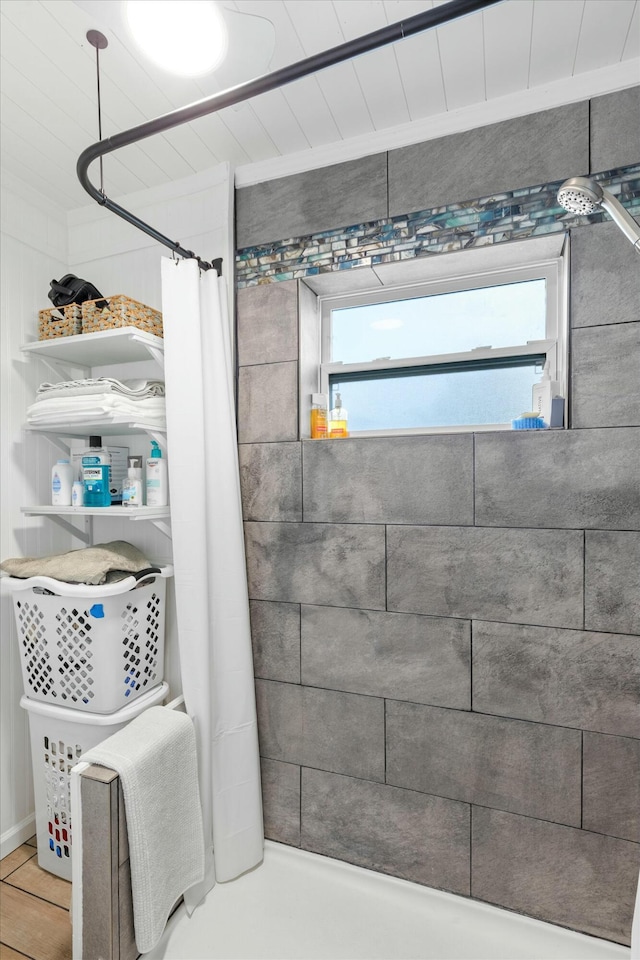 bathroom featuring shower / bath combo and a wealth of natural light