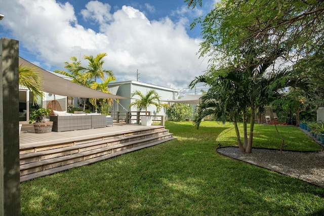 view of yard featuring a wooden deck and an outdoor living space