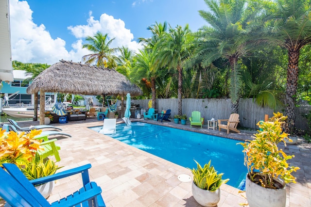 view of swimming pool featuring a gazebo and a patio