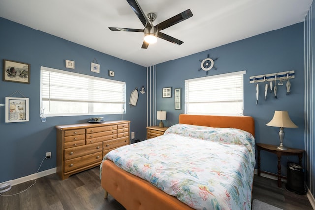 bedroom with ceiling fan, dark hardwood / wood-style floors, and multiple windows