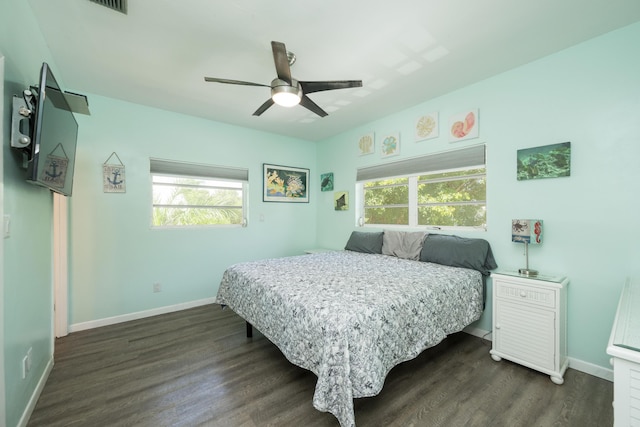 bedroom featuring dark wood-type flooring and ceiling fan