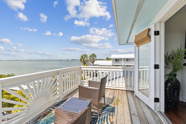 balcony featuring a water view