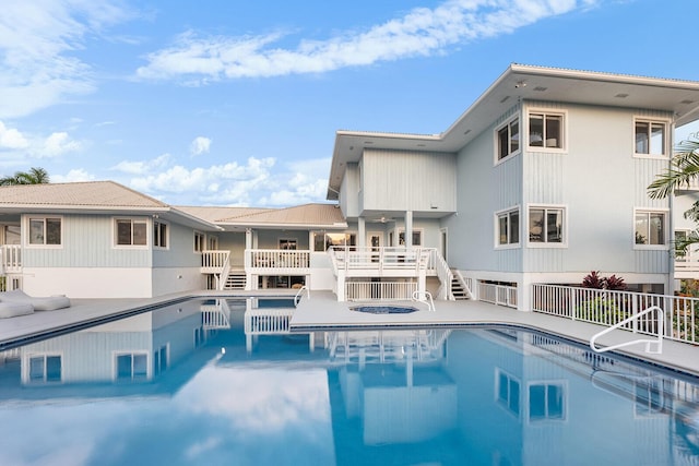 view of pool featuring a hot tub