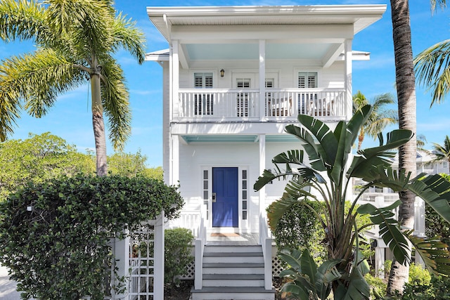 coastal home featuring a balcony