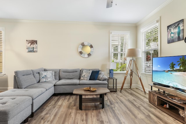 living room featuring ornamental molding, hardwood / wood-style floors, and ceiling fan