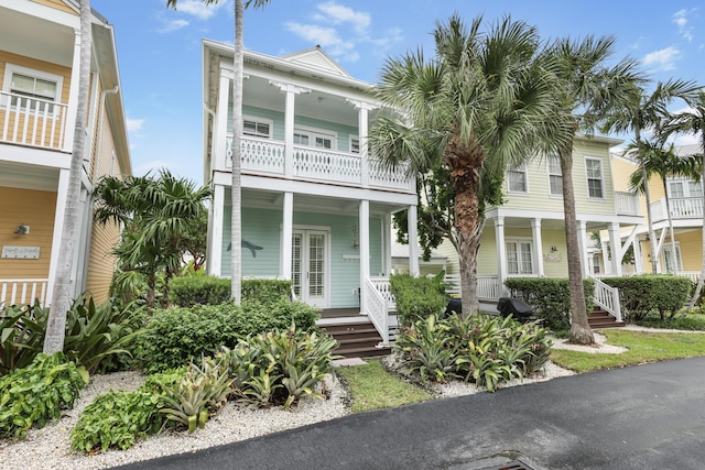 view of front of home featuring a balcony