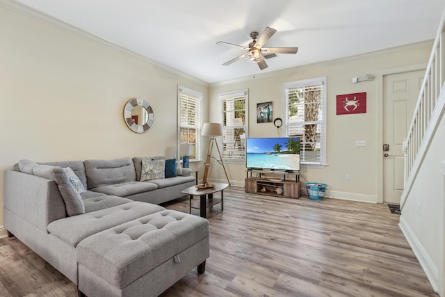 living room with crown molding, ceiling fan, and hardwood / wood-style flooring