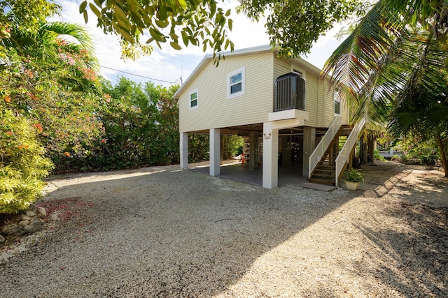 view of side of property featuring a carport